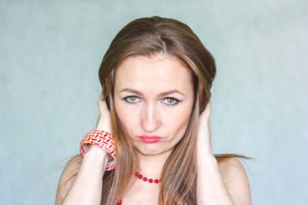 frustration and resentment concept. over white background bewitching woman. horizontal orientation...