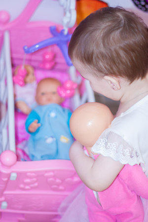 a young mother calms a newborn babyの写真素材