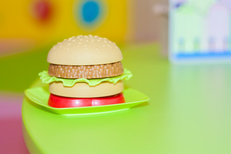 harmful breakfast. hamburger. malnutrition. on the table with an empty chairの写真素材