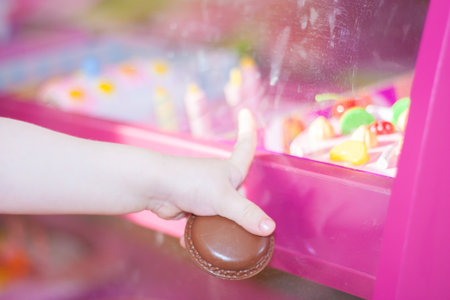 choice in the storefront. sweet chocolate cake and little girl handの写真素材
