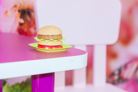 school breakfast. hamburger. malnutrition. on the table with an empty chairの写真素材