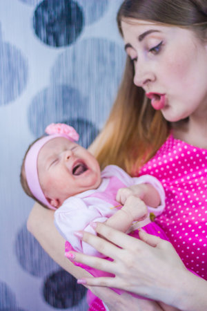 child crying. colic and a sick stomachの写真素材