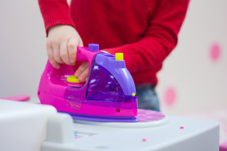 safety regulations. children and household appliances. Burning aid techniqueの写真素材