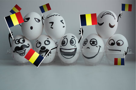 belgium football championship. concept of a comic victory. fans. funny eggs with a face with small flagsの写真素材