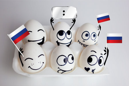 russia football championship. concept of funny fans - eggs. emotions on the faces of fans with a blank banner under the overheadの写真素材