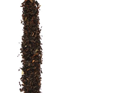 Black tea on a white background. Tea leaves.の写真素材