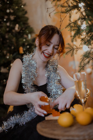 Warm soft light, Christmas tree background, joyful home atmosphere, elegant celebration and culinary creativity.の写真素材