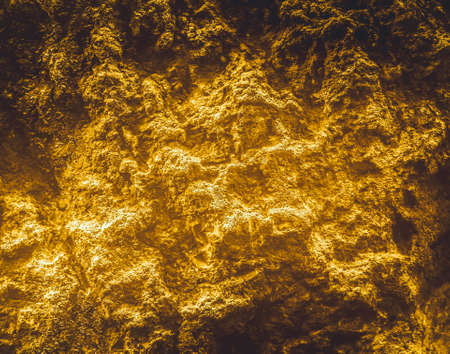 Rough structure mineral. Gold texture. Golden Ore rocks. Stone background. Abstract texture. Rock pile. Stone texture. Structure. Shimmering surface. Precious Foil.Rock texture.の写真素材