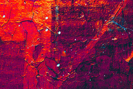 Wall red abstraction. Dark Backgrounds. Lava frozen. Paint spots. Rock surface with cracks. Rock...