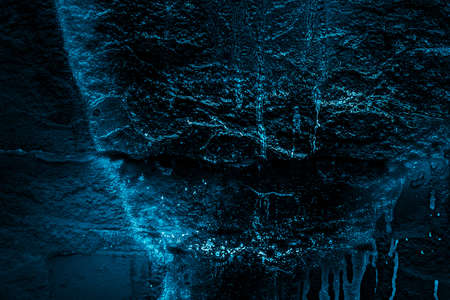 Rock texture. Dark stone wall. Stone background. Rock surface with holography, nacre. Wall...