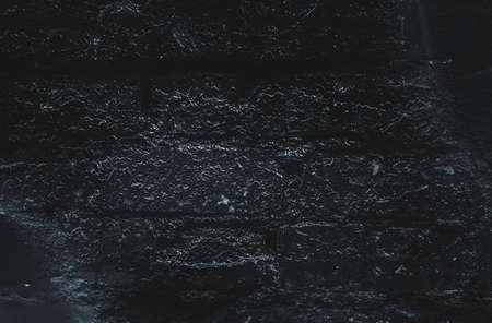 Black texture. Stone background. Dark marble. Rock texture. Rock surface with cracks. Rock pile....