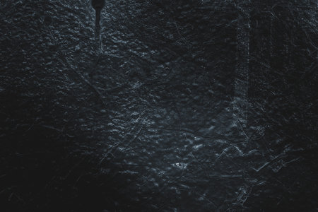 Black texture. Stone background. Dark marble. Rock texture. Rock surface with cracks. Rock pile. Paint spots wall. Grunge Rough structure. Abstract texture.の写真素材