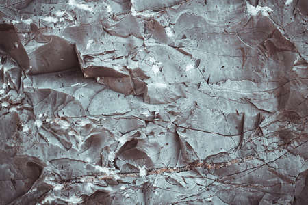 Silver Wall. Dark marble. Rock texture. Black texture. Stone background. Rock pile. Paint spots. Rock surface with cracks. Grunge Rough structure. Abstract texture.の写真素材