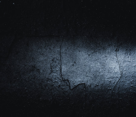 Black texture. Stone background. Dark marble. Rock texture. Rock surface with cracks. Rock pile. Paint spots wall. Grunge Rough structure. Abstract texture.の写真素材