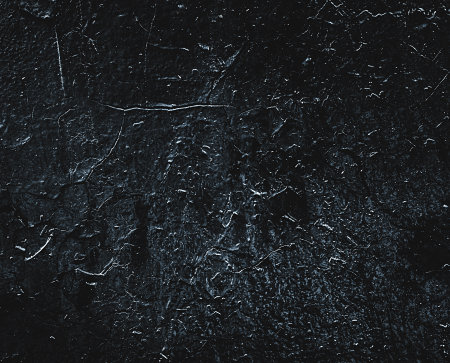 Black texture. Stone background. Dark marble. Rock texture. Rock surface with cracks. Rock pile. Paint spots wall. Grunge Rough structure. Abstract texture.の写真素材