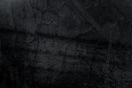 Black texture. Stone background. Dark marble. Rock texture. Rock surface with cracks. Rock pile. Paint spots wall. Grunge Rough structure. Abstract texture.の写真素材