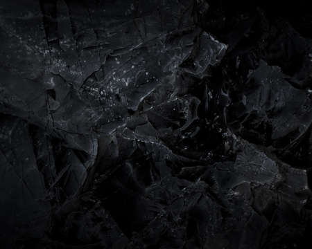 Black texture. Stone background. Dark marble. Rock texture. Rock surface with cracks. Rock pile. Paint spots wall. Grunge Rough structure. Abstract texture.の写真素材