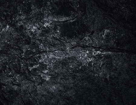 Black texture. Stone background. Dark marble. Rock texture. Rock surface with cracks. Rock pile. Paint spots wall. Grunge Rough structure. Abstract texture.の写真素材