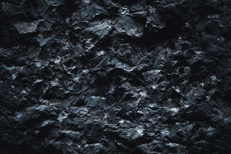 Black texture. Stone background. Dark marble. Rock texture. Rock surface with cracks. Rock pile. Paint spots wall. Grunge Rough structure. Abstract texture.の写真素材