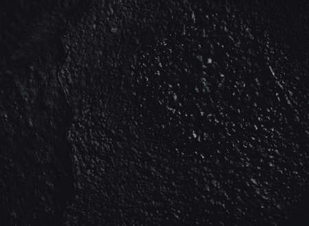 Black texture. Stone background. Dark marble. Rock texture. Rock surface with cracks. Rock pile. Paint spots wall. Grunge Rough structure. Abstract texture.の写真素材