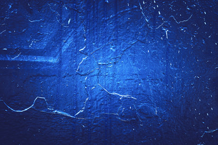 Rock texture. Dark stone wall. Stone background. Rock surface with holography, nacre. Wall abstraction. Paint spots. Rock surface with cracks. Abstract texture.の写真素材