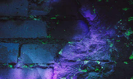 Rock texture. Dark stone wall. Stone background. Rock surface with holography, nacre. Wall abstraction. Paint spots. Rock surface with cracks. Abstract texture.の写真素材