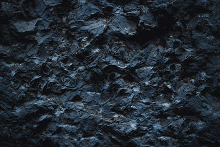 Black texture. Stone background. Dark marble. Rock texture. Rock surface with cracks. Rock pile. Paint spots wall. Grunge Rough structure. Abstract texture.の写真素材