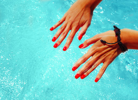 The sign of the hand is very good. Background beach with sea wave, Es Trenc, Mallorca. Relax atmosphere. Blue sky and azure coast.の写真素材