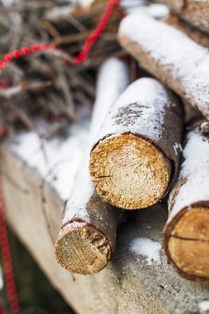 firewood under the snow in the street