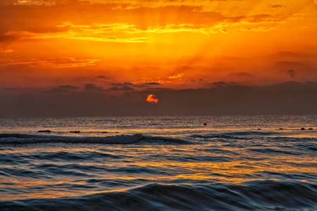 Mediterranean Sea orange sunset on the beachの写真素材