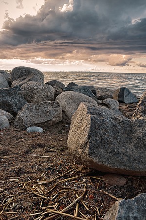 Sunset on the shore of Finnish Gulf stone