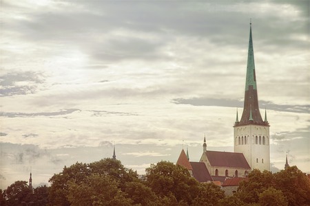 View of old part of Tallinn, spire of Oleviste church, Estonia in summer dayの写真素材