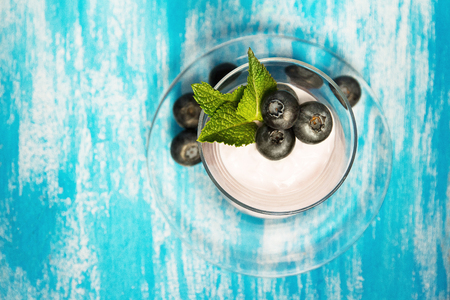 fresh blueberries in yogurt with mintの写真素材