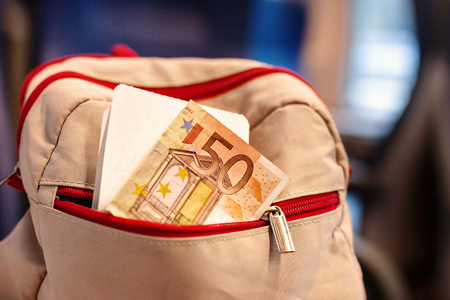 backpack with ticket, money 50 euros in pocketの写真素材