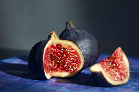 fruit of blue ripe figs in section side view, still life, minimalismの写真素材