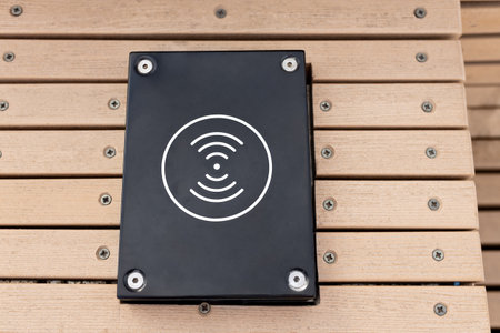 device for charging phones and other digital devices in city parkの写真素材