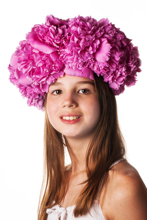 Girl with wreath of pink flowers on isolated white backgroundの写真素材
