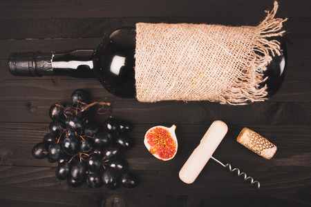 Food background with red wine, figs, grapes and cheeseの写真素材
