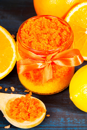 Homemade sugar scrub with Orange on a wooden backgroundの写真素材
