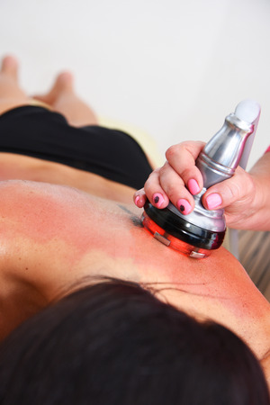 Rf skin tightening. Vacuum massage. Hardware cosmetology. Body care. Non surgical body sculpting. anti-cellulite and anti-fat therapy in beauty salon.の写真素材