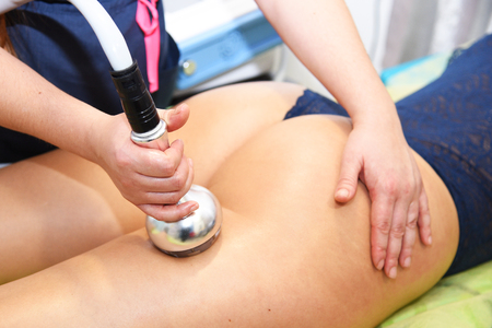 Rf skin tightening. Vacuum massage. Hardware cosmetology. Body care. Non surgical body sculpting. anti-cellulite and anti-fat therapy in beauty salon.の写真素材