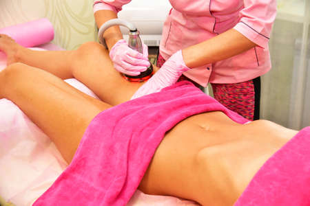 Vacuum massage. Hardware cosmetology. Body care. Non surgical body sculpting. anti-cellulite and anti-fat therapy in beauty salon.の写真素材