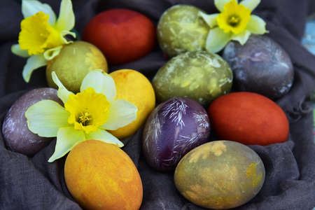 Multicolored Easter eggs on vintage background. View from above. Flat lay.の写真素材