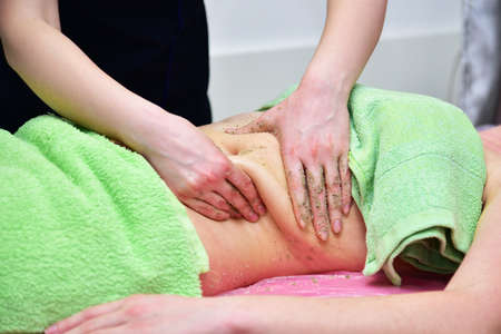 Body scrub procedure in a beauty salon. Body care.の写真素材
