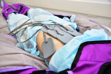 Myostimulation. Hardware cosmetology. Body care. Non surgical body sculpting. Anti-cellulite and anti fat therapy in beauty salon.の写真素材