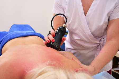 Rf skin tightening. Vacuum massage. Hardware cosmetology. Body care. Non surgical body sculpting. anti-cellulite and anti-fat therapy in beauty salon.の写真素材