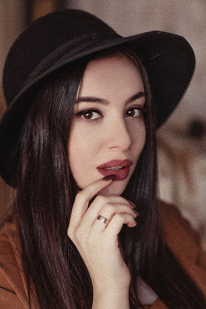 Portraits of a girl in a hatの写真素材