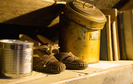 old retro leather sandals and tin can for loose productsの写真素材