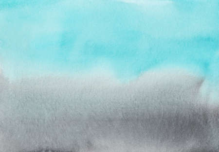 Watercolor light blue and gray gradient background texture. Multicolored soft ombre backdrop, hand painted. Stains on paper.の写真素材