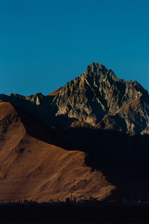 beautiful mountain and city landscape. light and shadow. the texture of the rocksの写真素材
